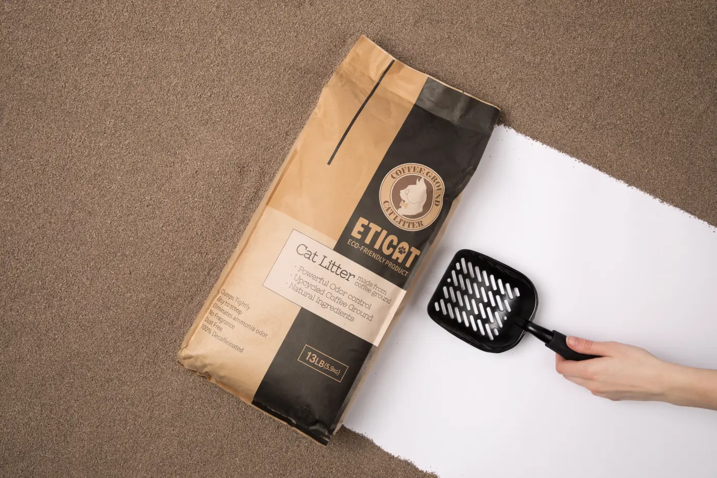 Overhead view of an ETICAT+ 13 lb package with a litter scoop